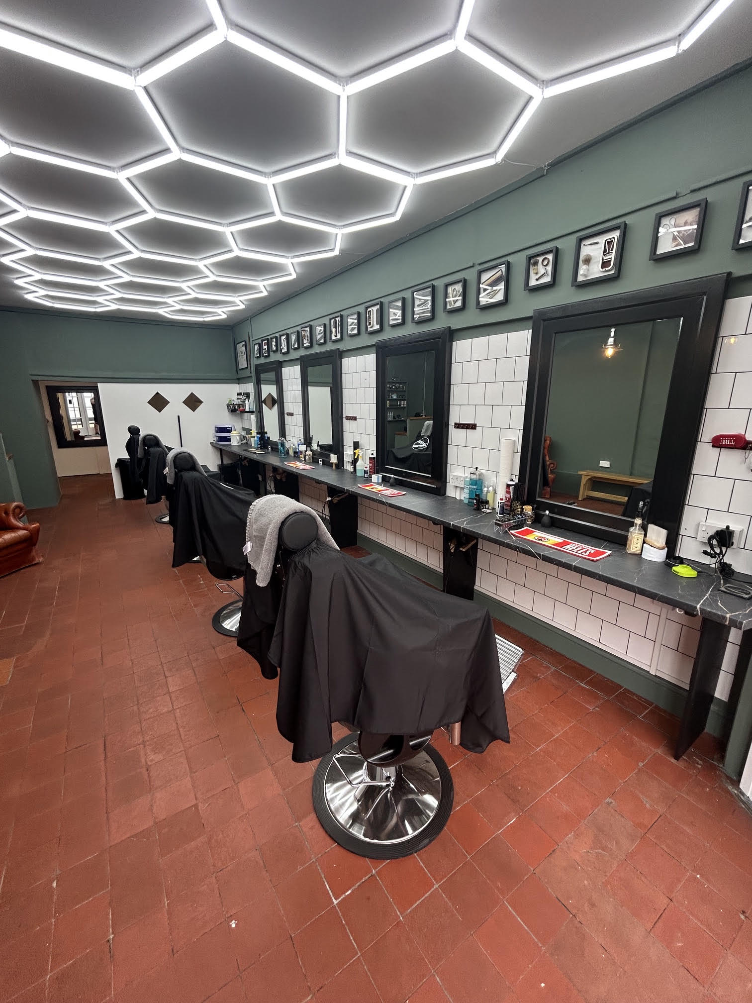 The full length of the shop under the hexagon lights